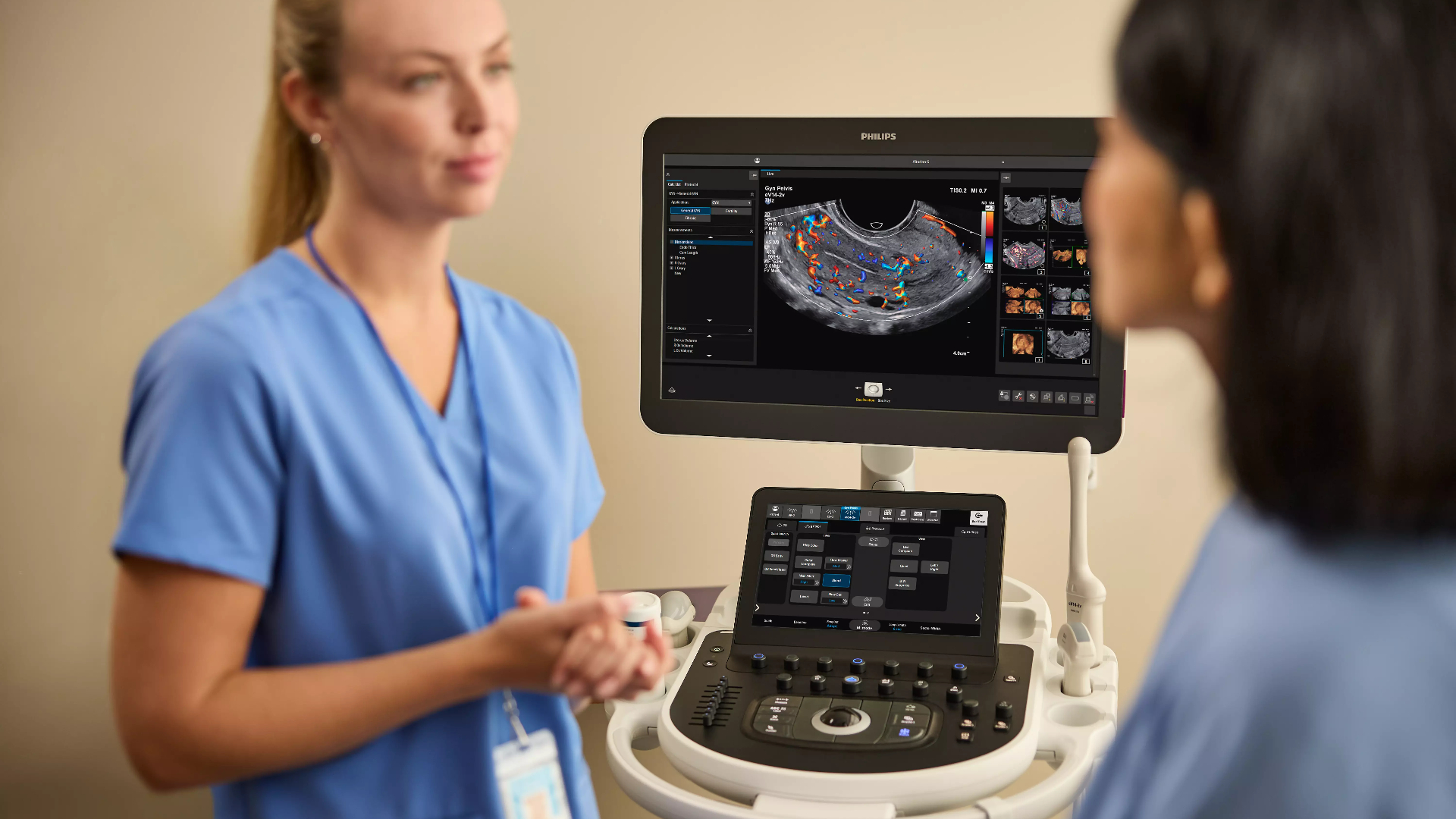 Patient consultation with Philips Alturion ultrasound A clinician consults with a patient alongside the Philips Alturion ultrasound system and eV14-2v transducer during a women’s health appointment.